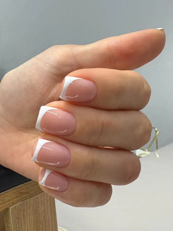 Crisp white French gel manicure by Elena