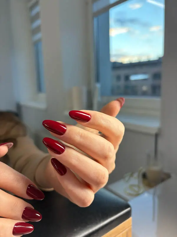 Deep wine red almond hard gel manicure by Elena