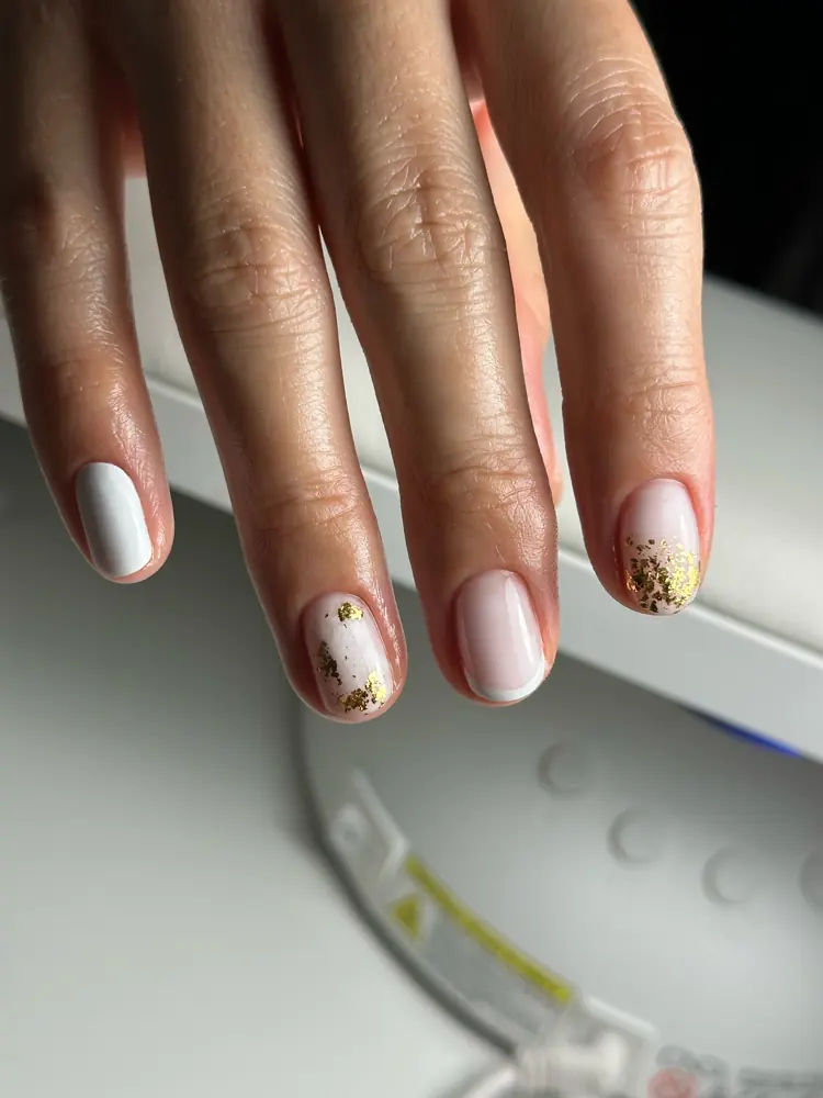 White gel manicure with gold-leaf design by Olya
