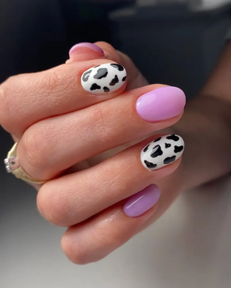 Purple cow-print gel nail art by Olya